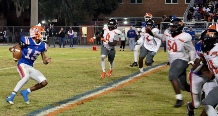 Lake Wales defenders surround and close in on Bartow quarterback Kaleef Valentine Friday. The Highlanders finished the regular season without yielding a rushing touchdown.